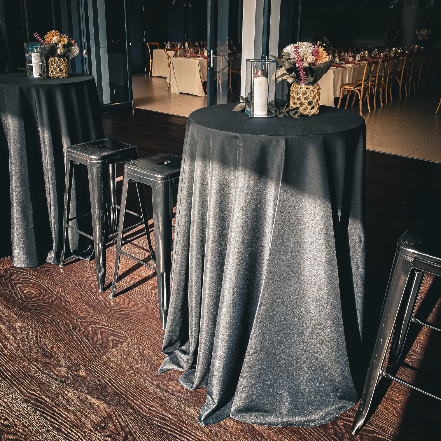 Black cocktail tables and black stools