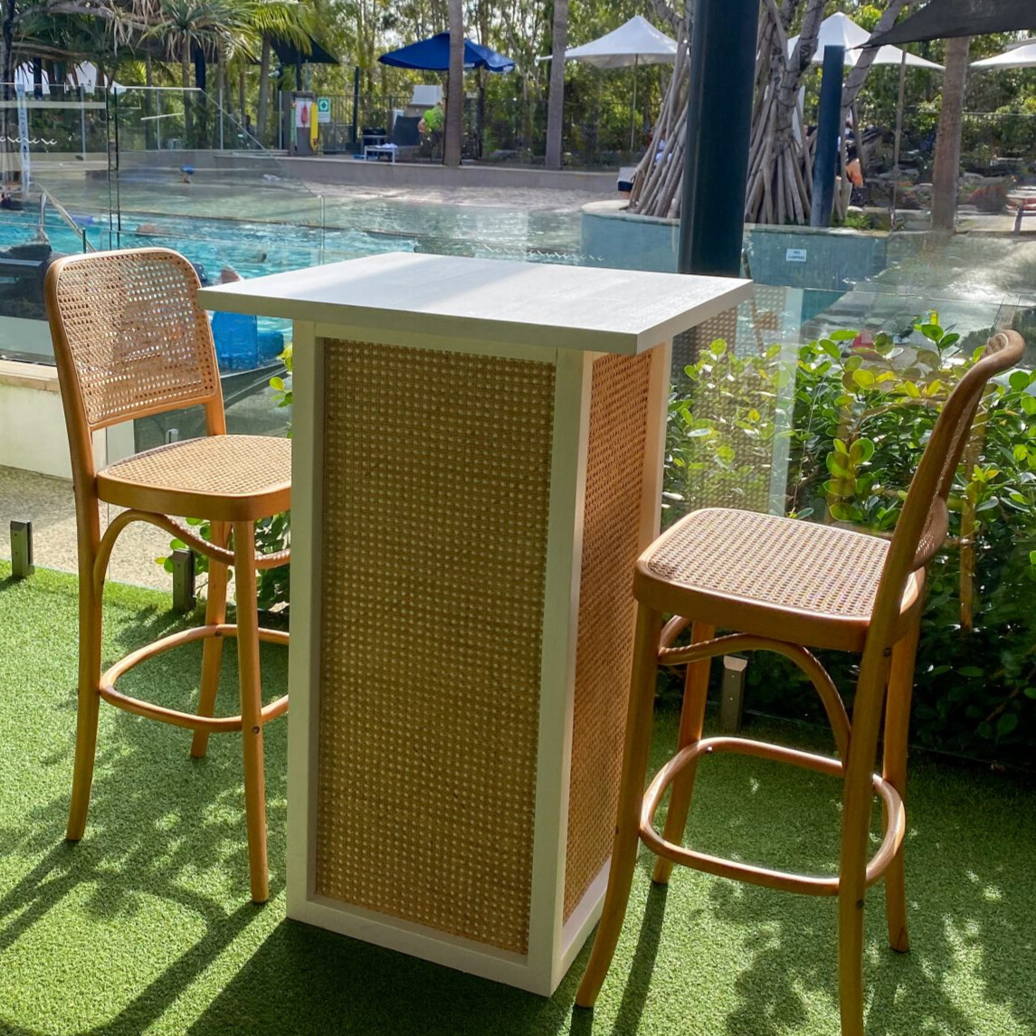 White rattan high bar and stools