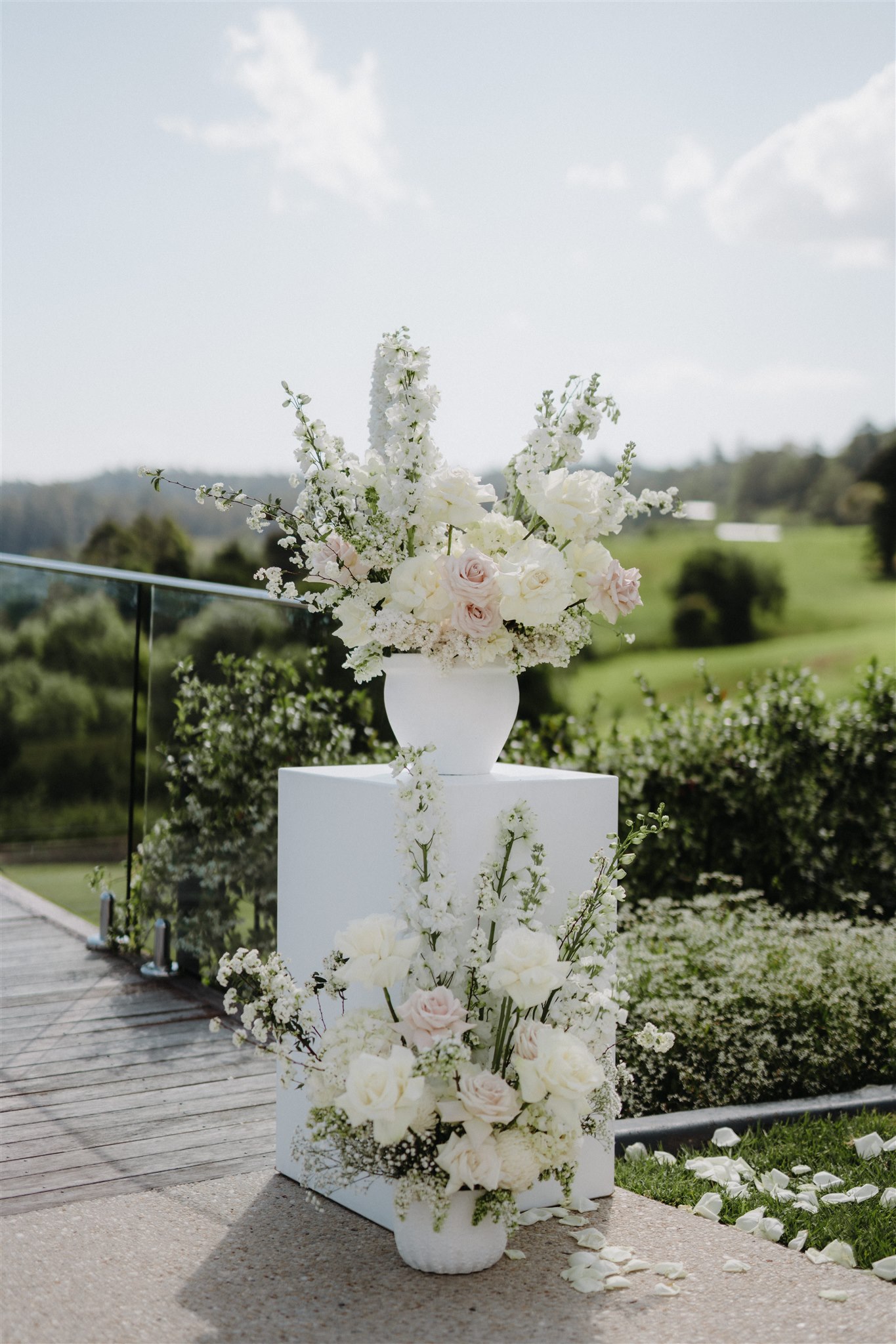 Small white plinths and urns