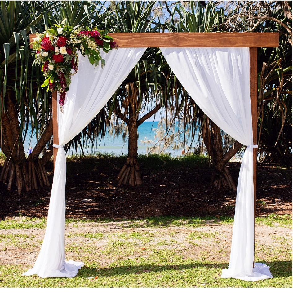 Hire Natural timber arbour with white chiffon curtains 